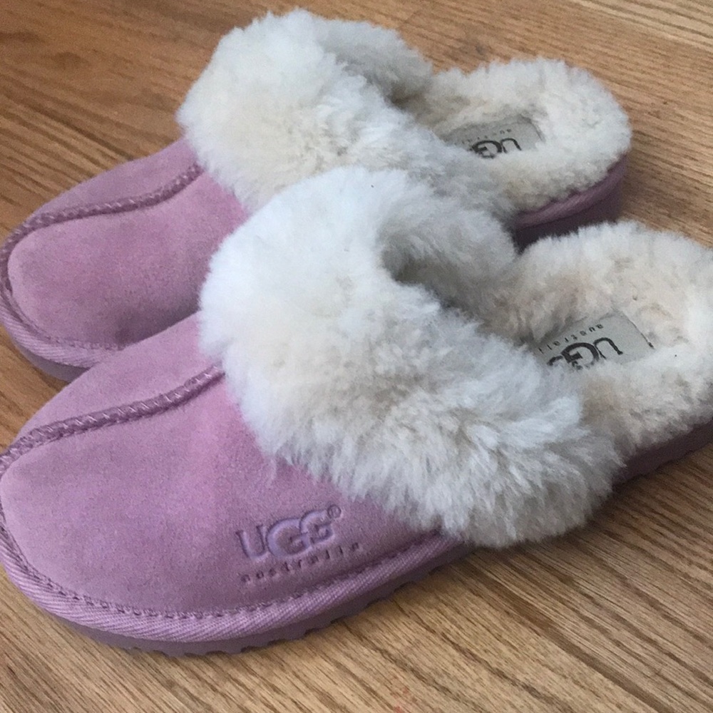 A pair of pink UGG slippers